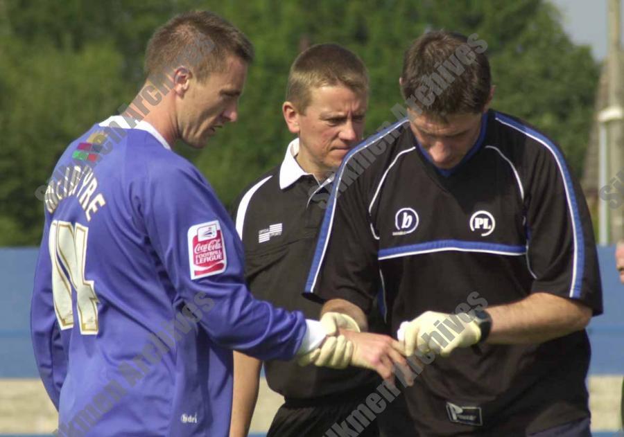 Kevin McIntyre receiving treatment from physio Paul Lake